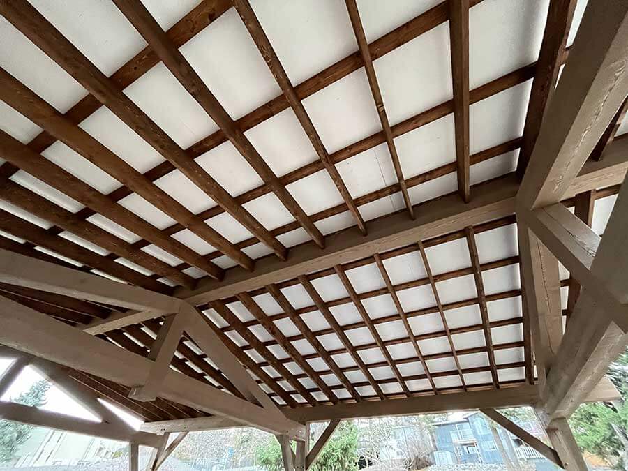 Intricate timber ceiling structure by Smith Timber Works, showcasing Canadian craftsmanship and design versatility.