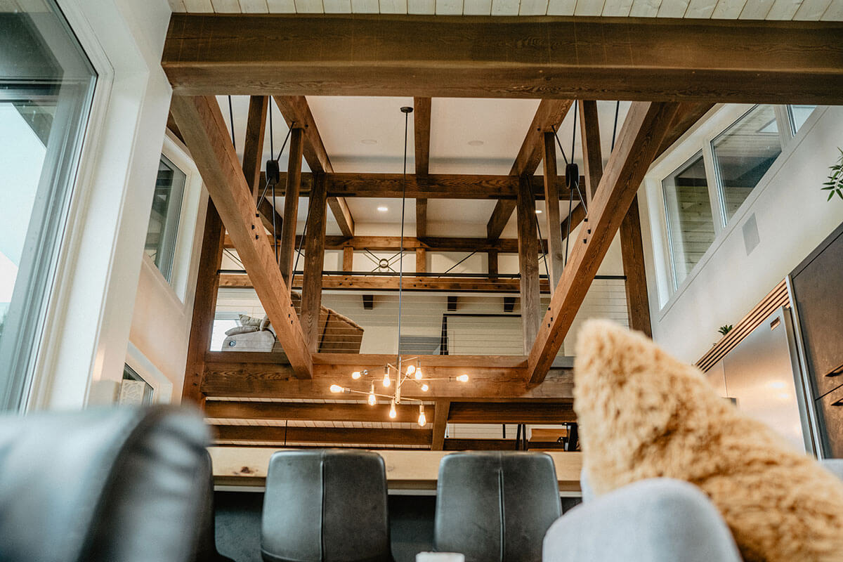 Interior view of exposed timber framing, highlighting Smith Timber Works' structural and architectural expertise.