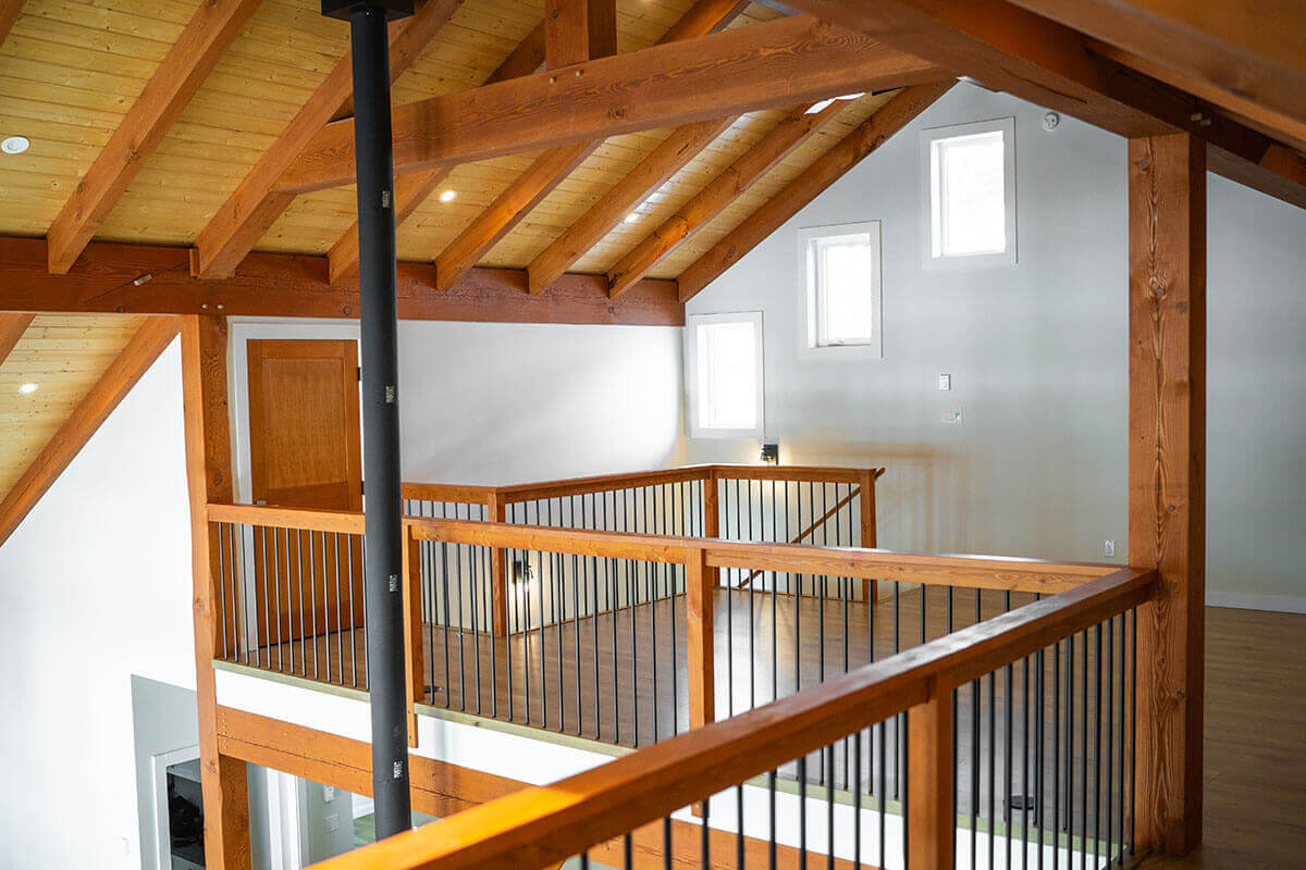 Vaulted timber ceiling and railing system by Smith Timber Works, British Columbia.