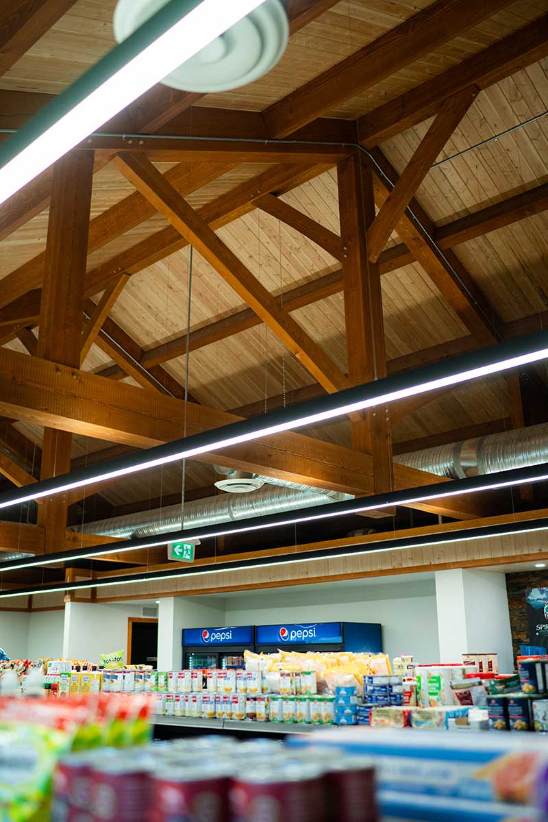 Commercial interior with exposed timber framing and wood ceiling by Smith Timber Works, showcasing Canadian design.