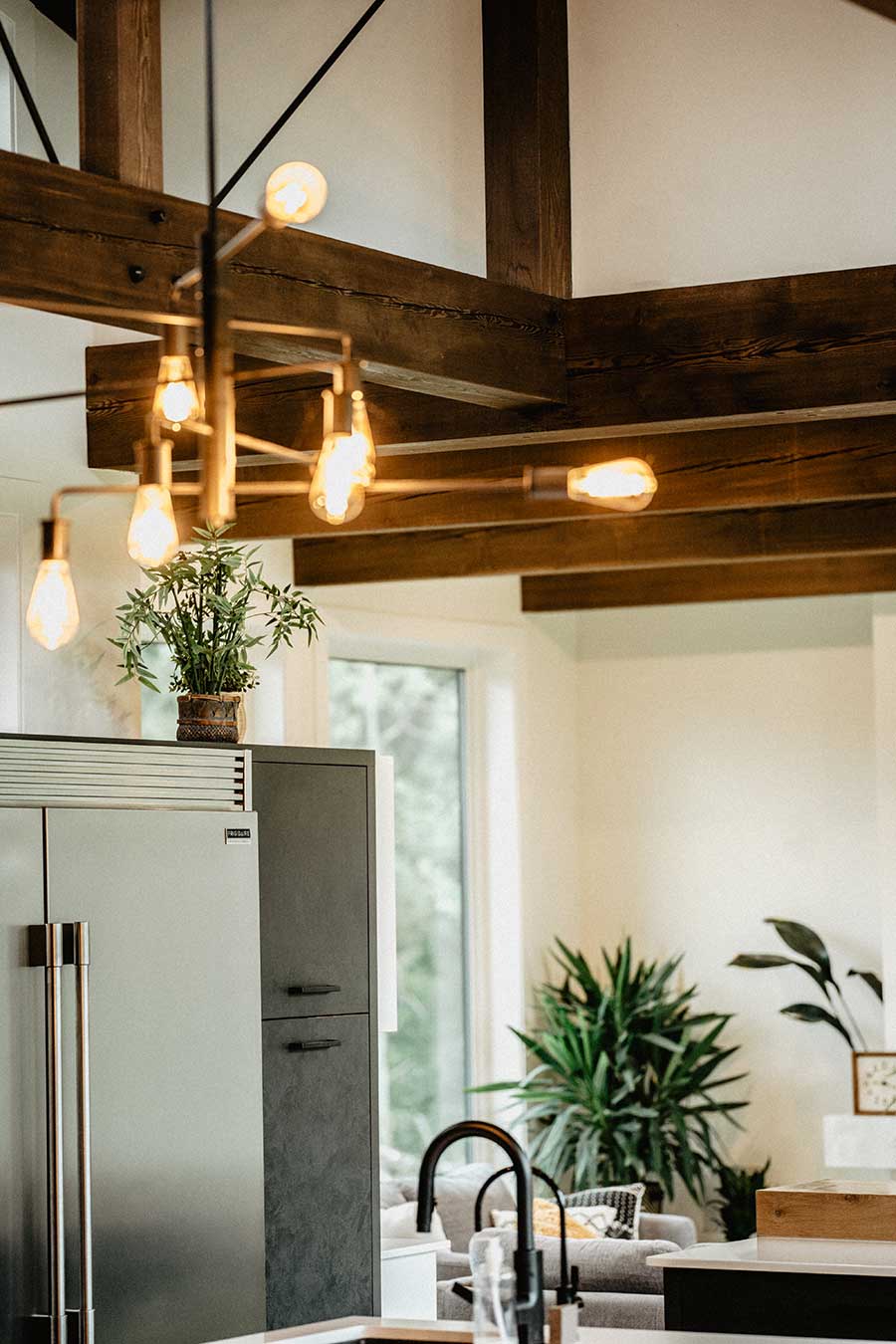 Open-concept interior with exposed timber beams by Smith Timber Works, featuring modern design and natural light.