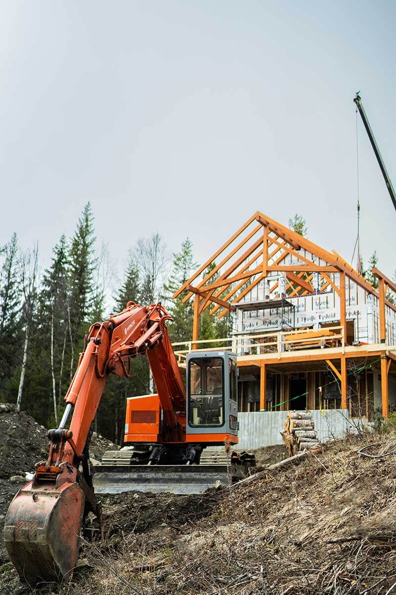 Excavator at Smith Timber Works construction site, British Columbia.