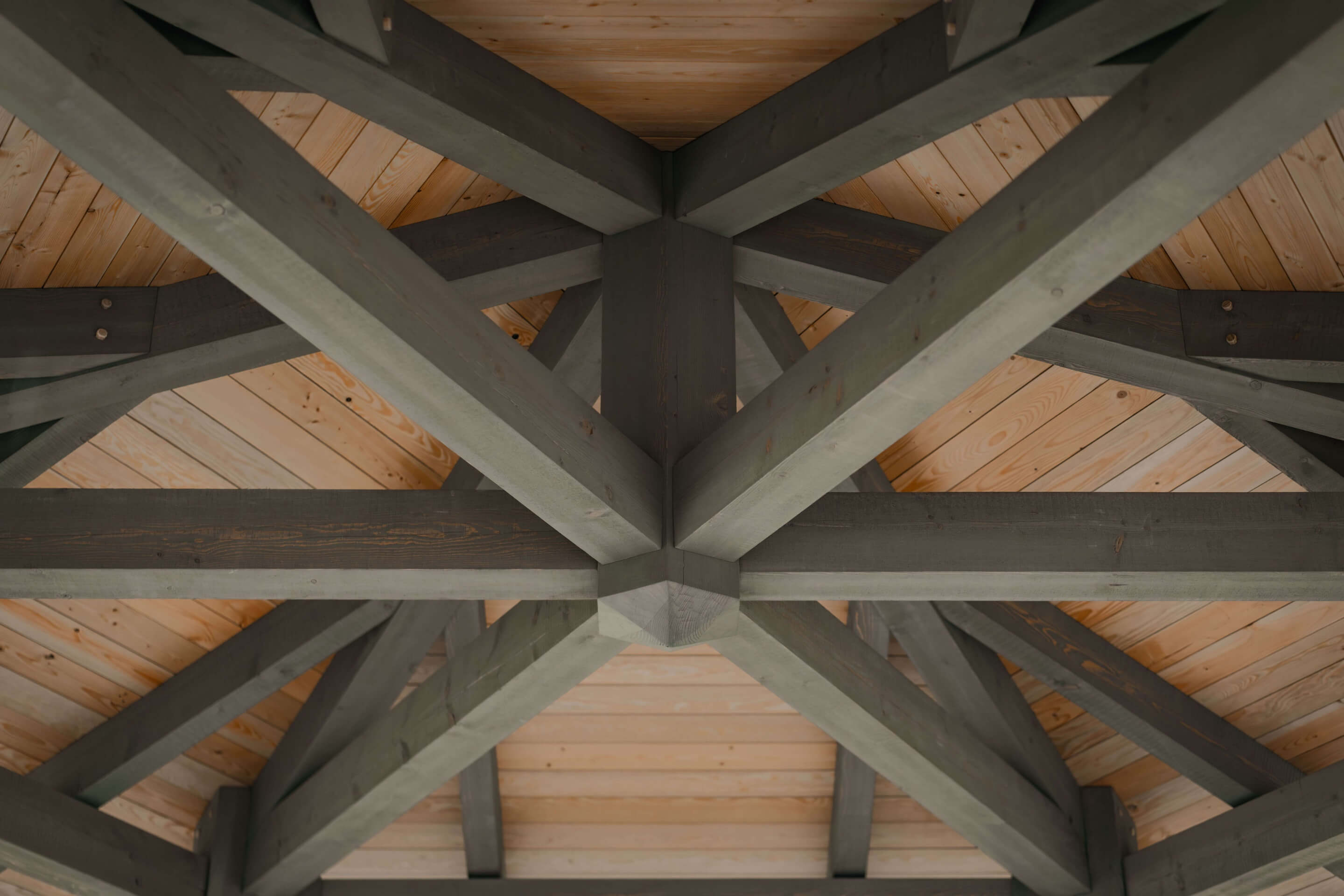 Detailed view of custom built, intricate timber frame ceiling, highlighting the precise craftsmanship and structural design by Smith Timber Works.
