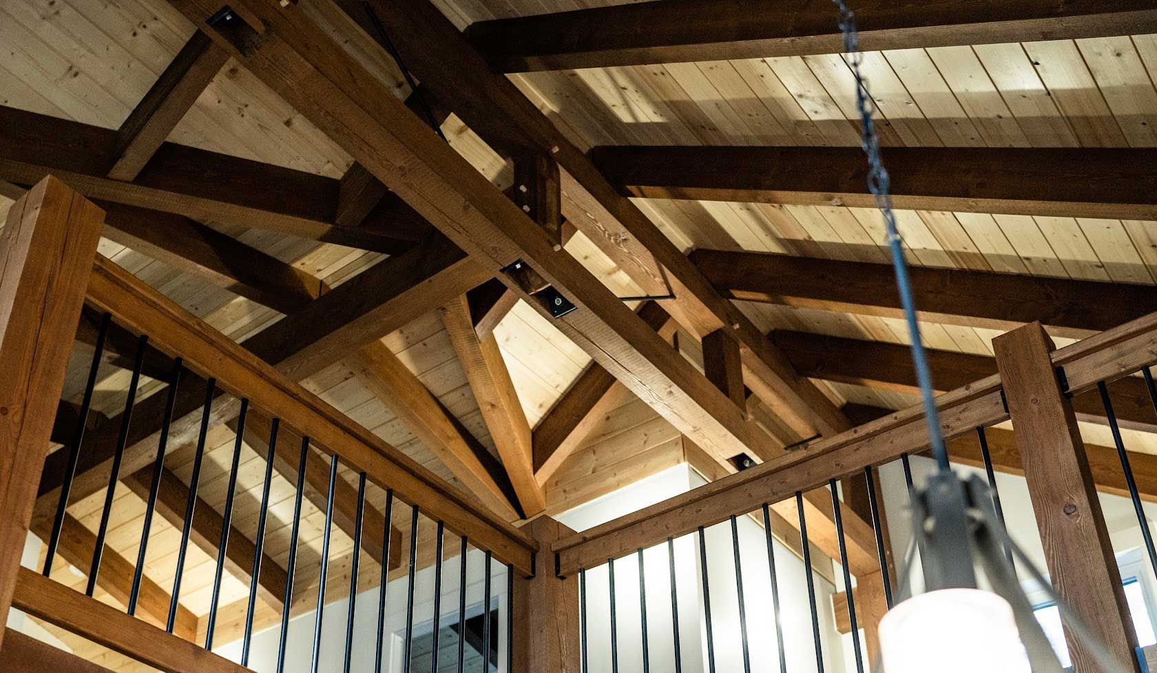 Intricate timber frame ceiling and railing by Smith Timber Works, British Columbia.