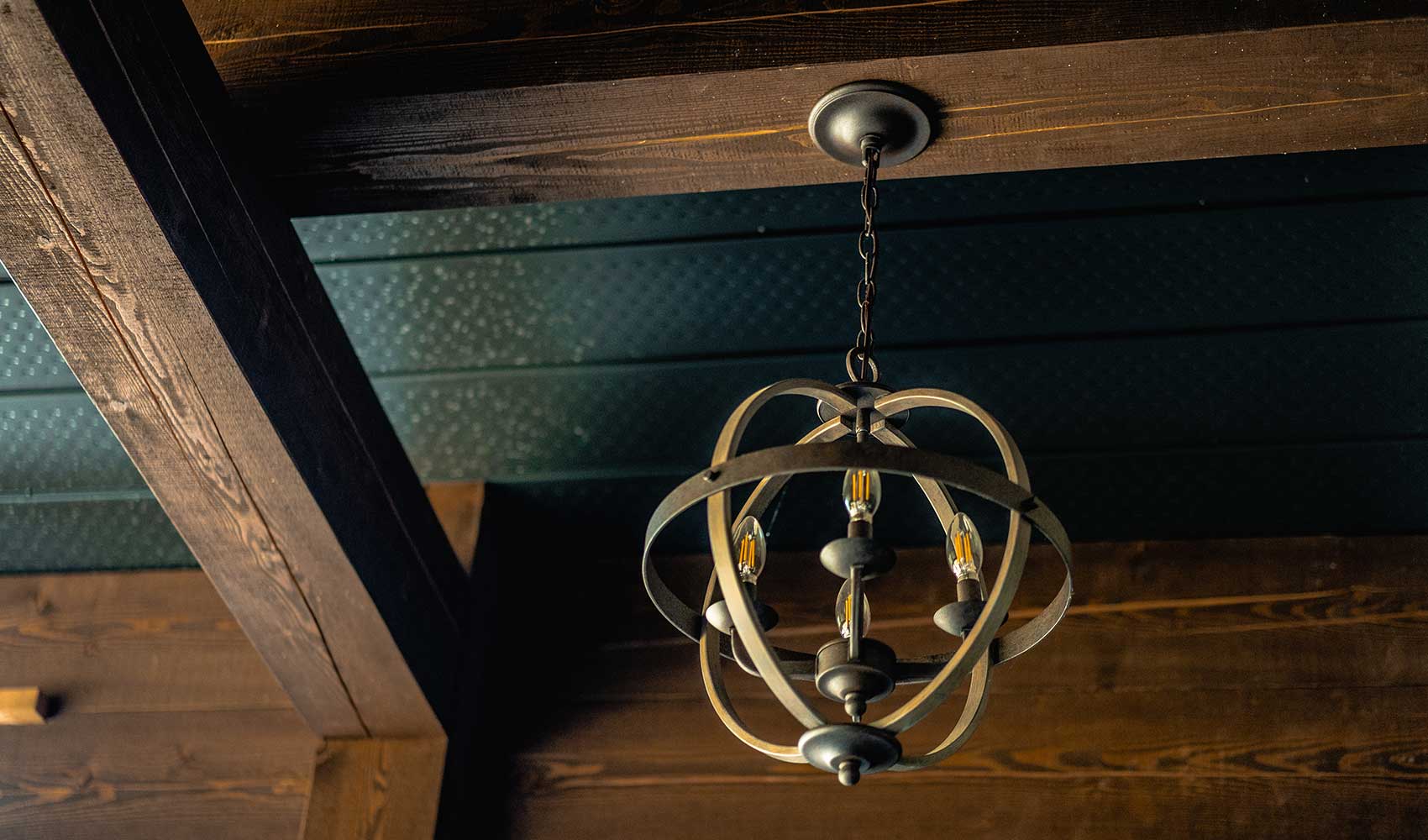 Exposed timber beams and custom lighting by Smith Timber Works.