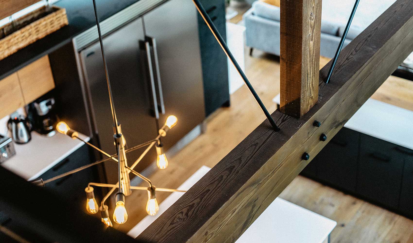 Kitchen view with timber beam, showcasing integrated design by Smith Timber Works.