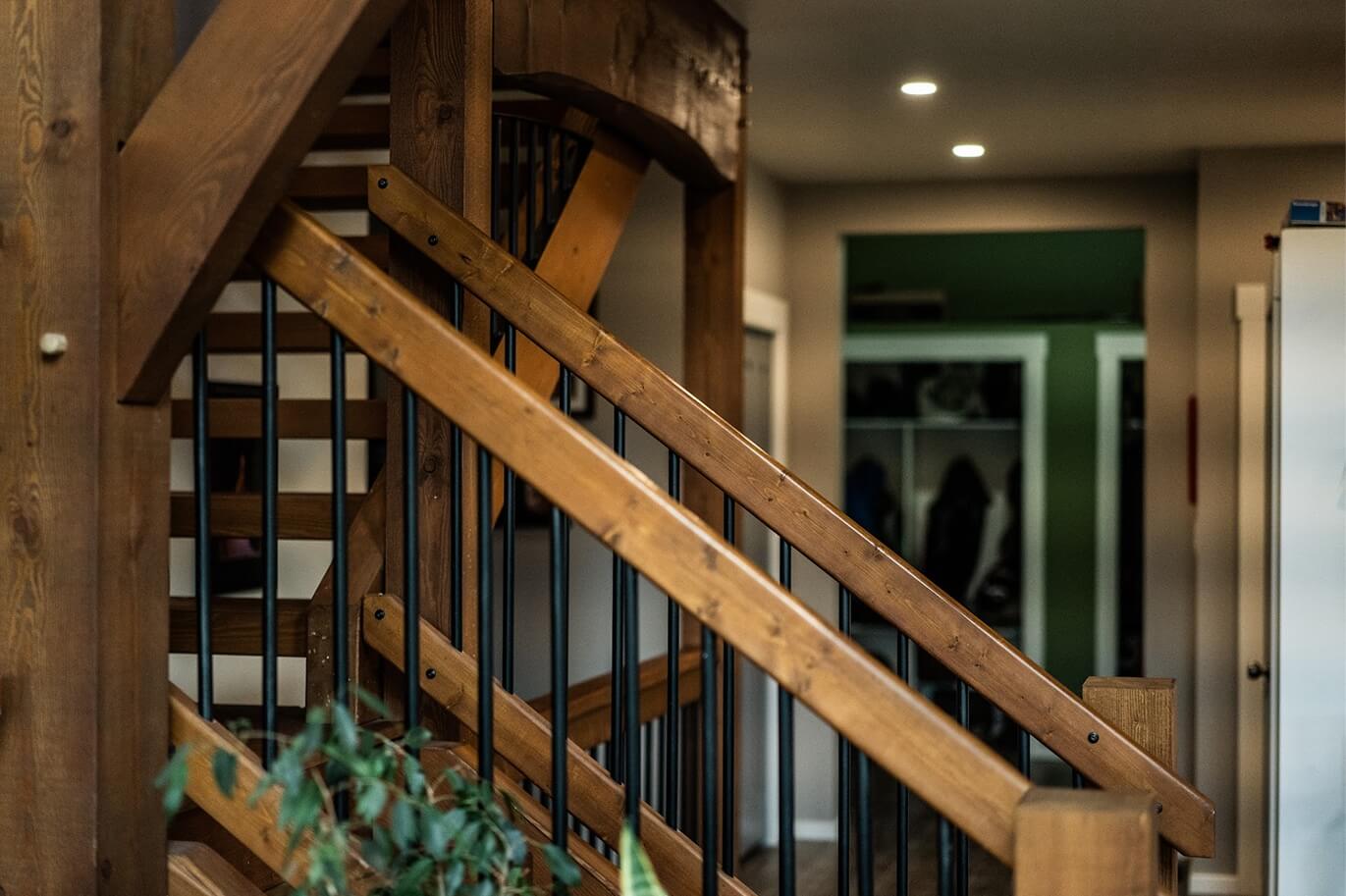 Interior timber staircase with handcrafted wood and metal railing, showcasing Smith Timber Works’ custom design and architectural detailing.